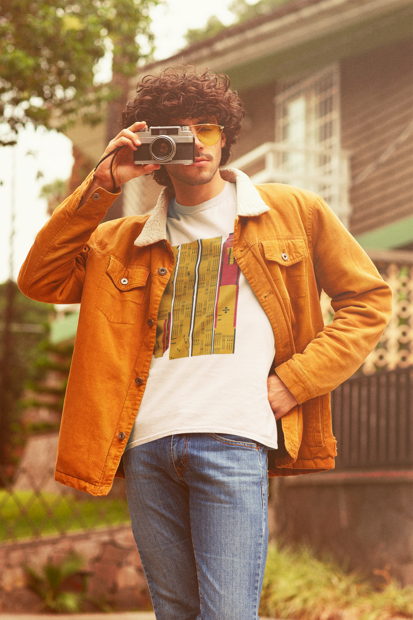 retro-mockup-of-a-curly-haired-photographer-wearing-a-t-shirt-m10120_1.png